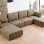 Sofá modular con brazos 4 plazas + 2 chaiselongue. Tapizado en tejido beige. Medidas: 366 x 183 x 93 cm.  Si necesitas otra medida o disposición puedes componerla mediante nuestros módulos independientes. Módulo con respaldo y brazo. Módulo con respaldo sin brazo. Módulo puff para chaiselongue.